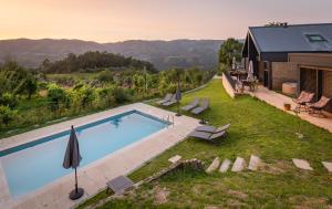 an overhead view of a swimming pool in a yard at Casas de Bouro 2 in Terras de Bouro