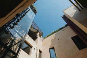 a glass window on the side of a building at Casa 300Mila in Lecce