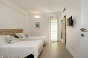 A bed or beds in a room at Meravilla