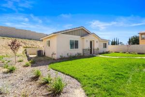 a small house with a grassy yard at Entire Guesthouse for Rent in San Bernardino in San Bernardino