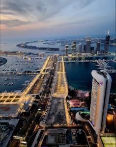 an aerial view of a city with a harbor and buildings at SKY High Stays in Dubai