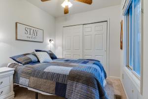 a bedroom with a bed and a window at Riverfront Brookston Retreat w/ Deck & River Tubes in Brookston