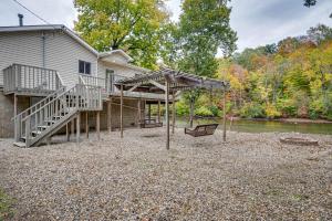 a playground in front of a house at Riverfront Brookston Retreat w/ Deck & River Tubes in Brookston