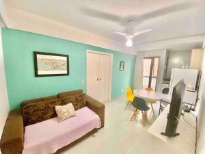 a living room with a couch and a table at Ocean Flat 606 in Vila Velha +15 photos