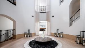 a lobby with a table in the middle of a room at The Ritz-Carlton Bacara, Santa Barbara in Santa Barbara