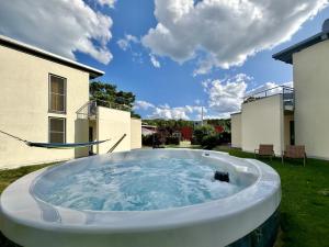 a large hot tub in the yard of a house at Filippa in Eldenburg