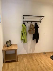 a room with a wall with a rack and clothes at Steinadler Gamsleiten FL - Skiing Holiday in Obertauern in Obertauern