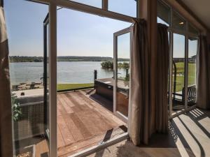 a view of the water from the balcony of a house at 1 Delamere Point in Northwich