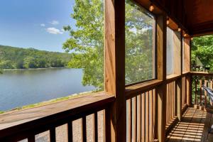 a view of a lake from a cabin window at Lakefront Branson Cabin 6 Mi to Branson Strip! in Branson West