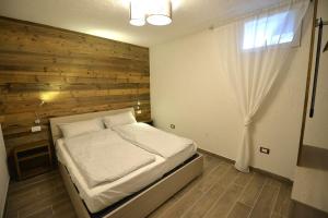 Giường trong phòng chung tại Taverna al ponte