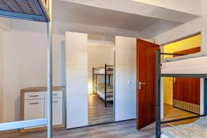 a room with two bunk beds and a mirror at Haci Babas Home in Bestwig