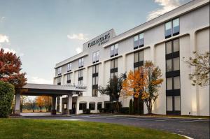 a rendering of the front of a hotel at Four Points by Sheraton Chicago Westchester/Oak Brook in Westchester
