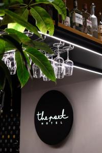 a shelf with several glass jars and a sign on it at The Poet Hotel in La Spezia