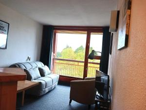 Un televizor și/sau centru de divertisment la Studio cosy pour 4 pers. proche des pistes à Arc 2000 - FR-1-411-332