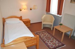 Postel nebo postele na pokoji v ubytování Hotel Pension Walzerstadt