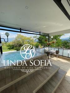 a sign for a villa with a swimming pool at Apartamento duplex exclusivo- Linda Sofia Belle in Santa Fe de Antioquia
