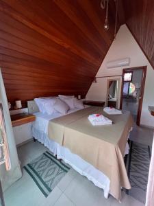 Cama ou camas em um quarto em Pousada Primavera