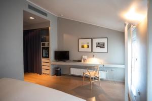 TV a/nebo společenská místnost v ubytování Hotel Casa Poli