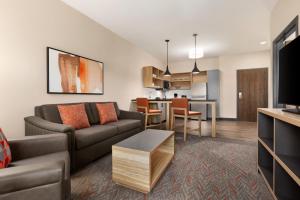 a living room with a couch and a table at Candlewood Suites Murfreesboro by IHG in Murfreesboro
