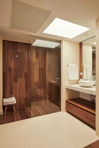 a bathroom with a shower and a sink at San Nicolas Luxury Home with prívate terrace in Córdoba