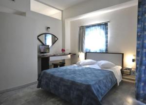 Posteľ alebo postele v izbe v ubytovaní Rodon Hotel