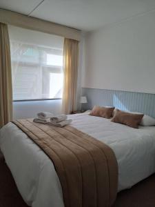 Postel nebo postele na pokoji v ubytování Hotel Capitán Eberhard