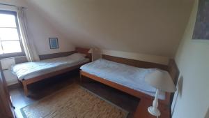 Voodi või voodid majutusasutuse Sunshine Villa Fonyódliget toas