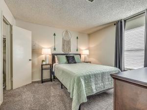 a small bedroom with a bed and a window at OU Sooner, Pool & Gym, BBQ, Netflix, 100mb Internet, LG Washer & Dryer, Close to OU! in Norman