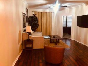 a living room with a couch and a table at Townhome Baptist South St JohnsTownCenter Beach in Jacksonville