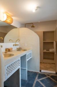 a kitchen with a sink and a counter in a room at RIAD MAJWRIL in Marrakesh