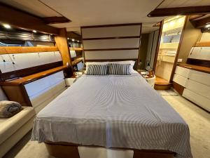 a large bed in the middle of a room at YACHT 20Metros in Barcelona