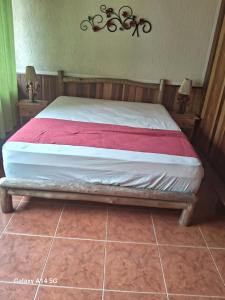 Giường trong phòng chung tại Casa da floresta