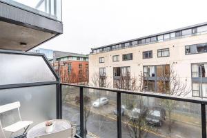 an apartment balcony with a view of a building at Grand Canal 2 Bedroom Flat in Dublin