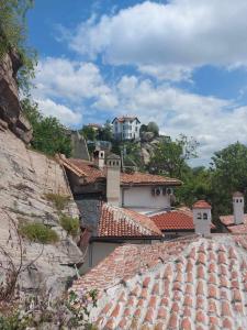 a group of roofs with a white house on a hill at Къща за гости Георги Божилов - Слона in Plovdiv