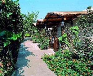 a house with a fence next to a garden at Aparthotel Villa Marinù in Ischia