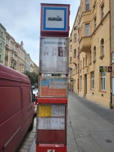 a street sign on the side of a city street at Sunfower Prague Suites in Prague