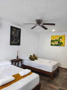 Postel nebo postele na pokoji v ubytování Villas Carlota Cancún