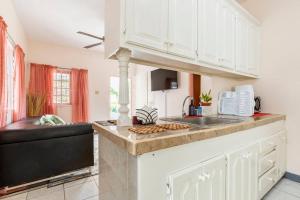 a kitchen with a sink and a counter top at Shaw Park Gem in Ocho Rios