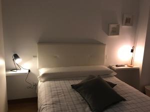Apartamentos Olga Cantabria客房内的一张或多张床位