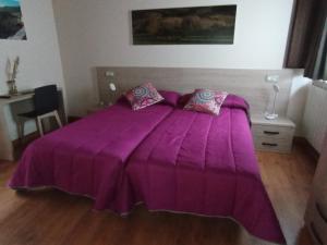 Łóżko lub łóżka w pokoju w obiekcie Hotel Rural Rio Molinar