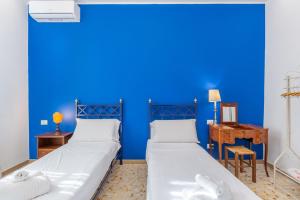A bed or beds in a room at Aqua Claudia and Anio Novus Apartments