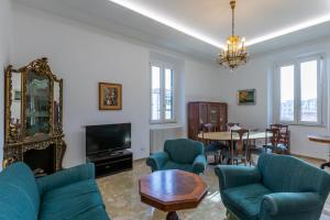 A television and/or entertainment centre at Aqua Claudia and Anio Novus Apartments