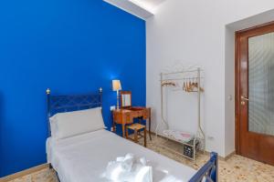 A bed or beds in a room at Aqua Claudia and Anio Novus Apartments