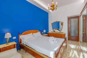 A bed or beds in a room at Aqua Claudia and Anio Novus Apartments