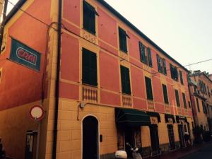 a building with a cow standing outside of it at IVANA Apartment in Levanto
