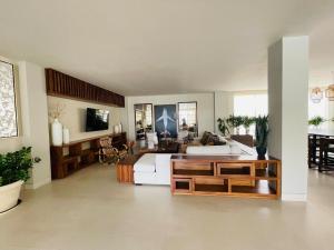 a large living room with a bed and a couch at CONDO VISTA AL MAR ZONA TEZAL in Cabo San Lucas
