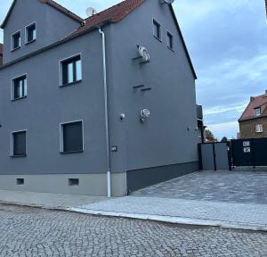 a white building with two knobs on the side of it at HT Appartement No.3 in Greppin