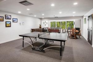 a living room with a ping pong table in it at Fall Ridge in Vail
