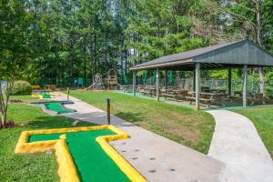 a park with a playground and a picnic shelter at River's Creekside Cabin in Ellijay