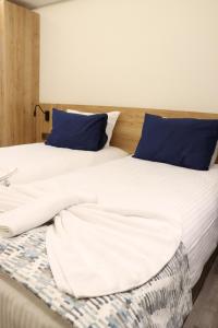 Postel nebo postele na pokoji v ubytování Dab Hotel Ulus